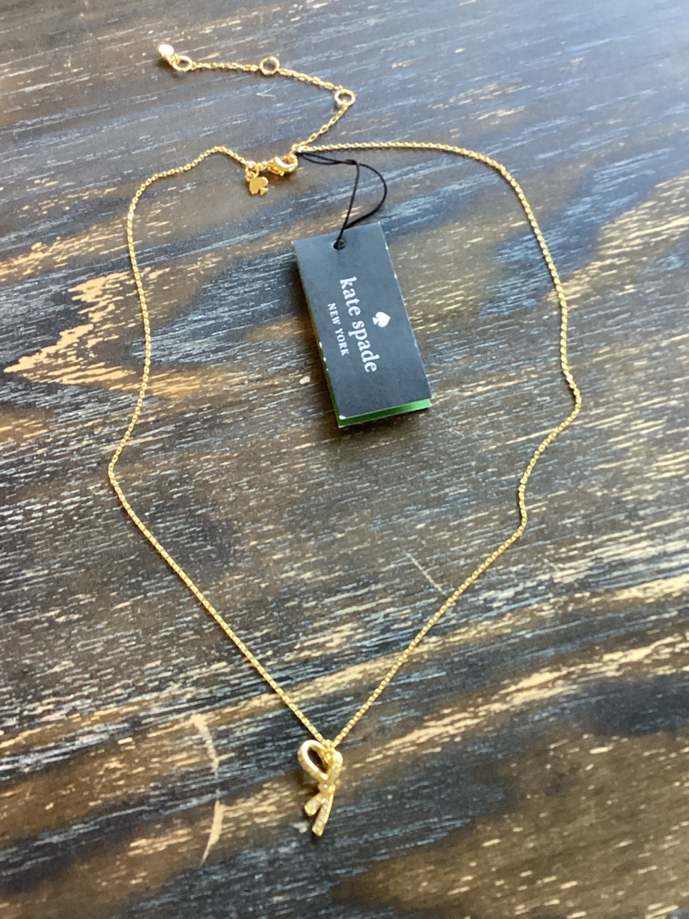 kate spade All Tied Up Pave Bow Gold Tone Pendant Necklace